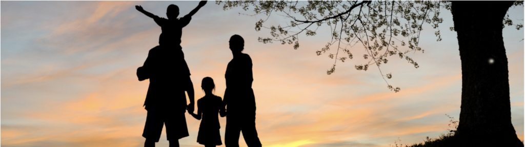 Family of 4 silhouette during sunset