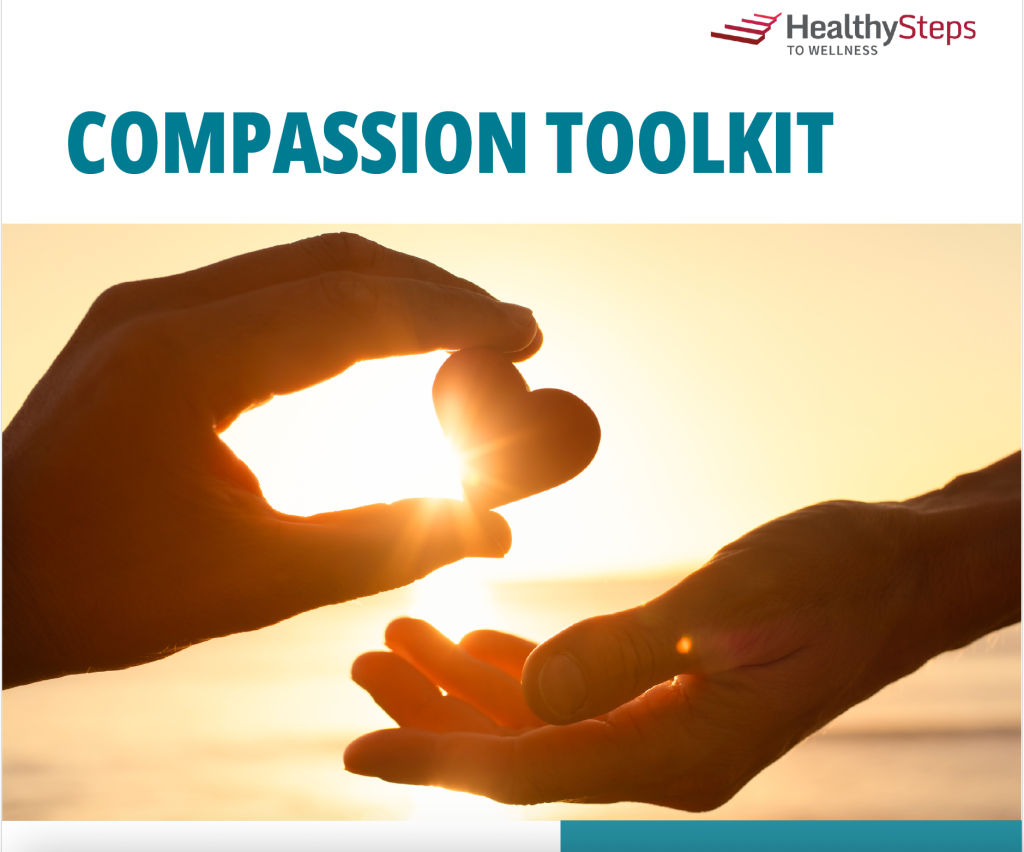 Compassion toolkit cover image with one hand holding a small heart passing it to another hand in gesture behind a sunset over the water