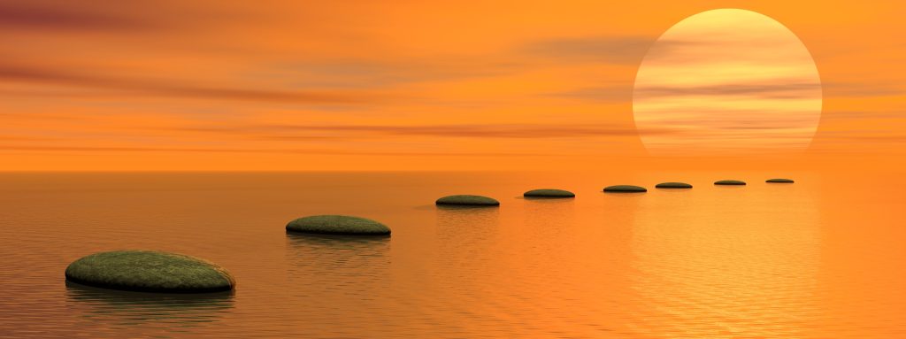 Grey stones steps upon the ocean going to the sun by sunset